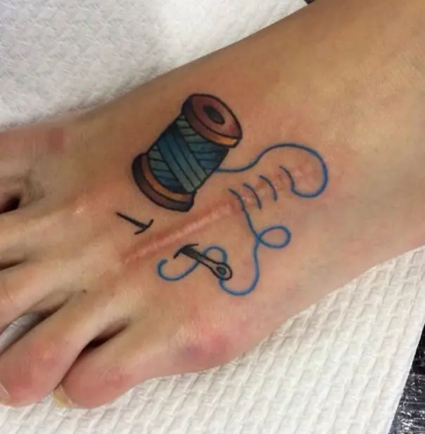 a foot with a tattoo on it